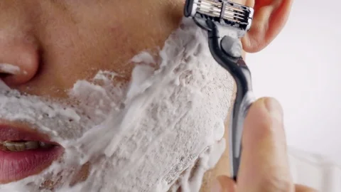 Man shaves his face. 스톡 동영상 69769282