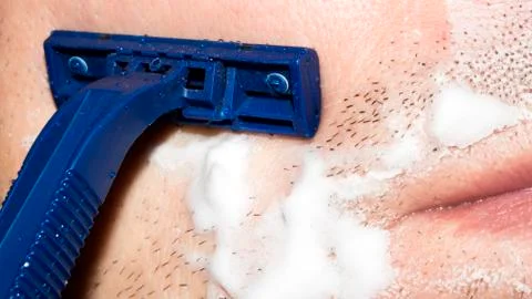 A man shaves the machine. Stock Photos
