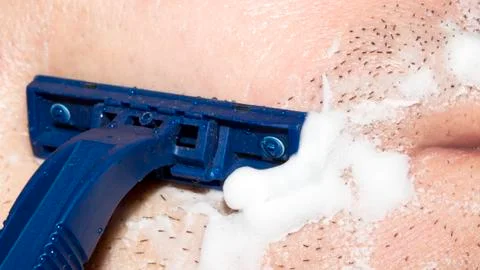 A man shaves the machine. Stock Photos