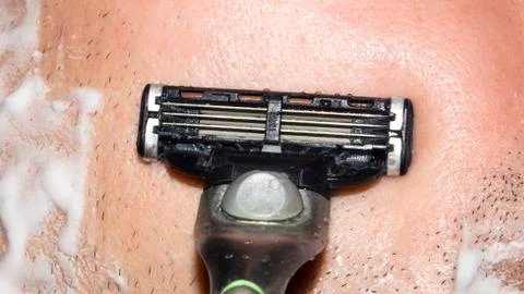 A man shaves the machine. Stock Photos