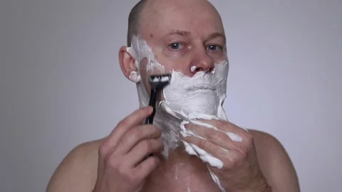 A man shaves with a razor. close-up. Stock Footage 223503420