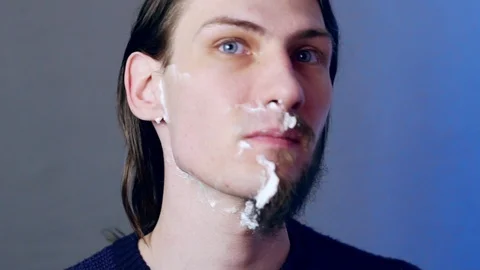 A man shaves with a razor Stock Footage 104335817