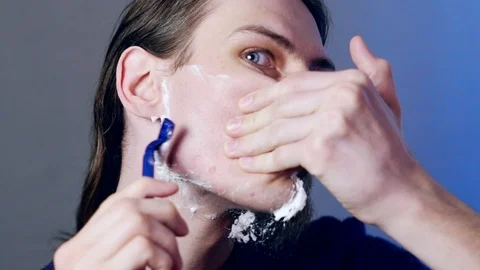 A man shaves with a razor Video stock 111123265
