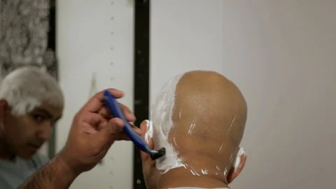 Man shaving back of head 2 Stock Footage 119257405