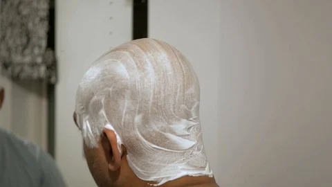 Man shaving back of head Stock Footage 119257438
