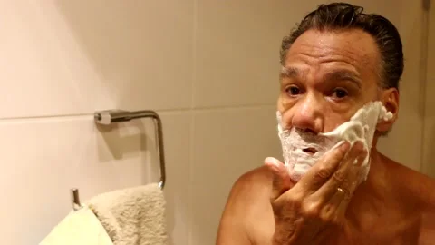 Man Shaving in the Bathroom Stock Footage 151553653