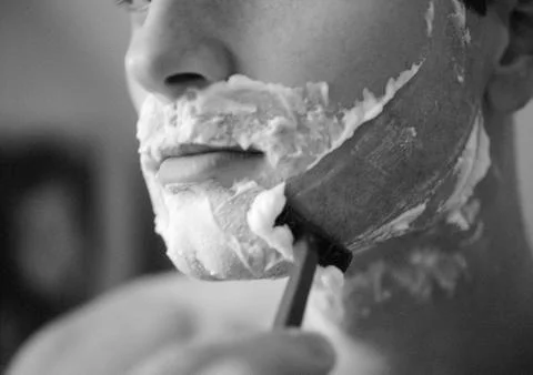 Man shaving, close-up, b&amp;w Stock Photos