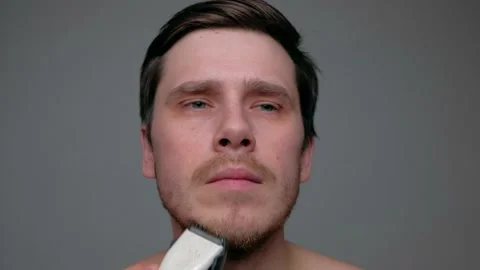 Man Shaving With Electric Razor. Stock Footage 168939051