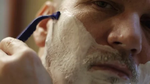 Man Shaving face Stock-Footage 72133838