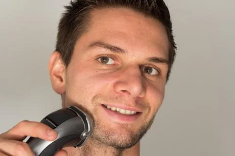 Man shaving face Stock Photos