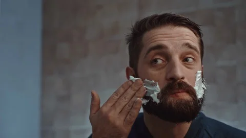 Man shaving foam on face Stock-Footage 107322317