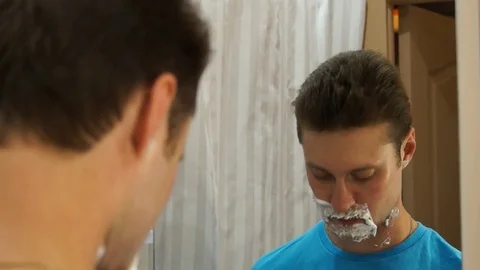 Man shaving with foam Stock Footage 80490313