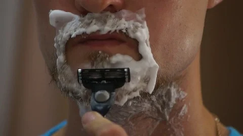 Man shaving with foam Stock Footage