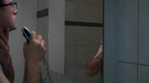 Man Shaving in front of Mirror Video stock 20462362