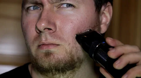 Man shaving his beard Stock Footage 36645700