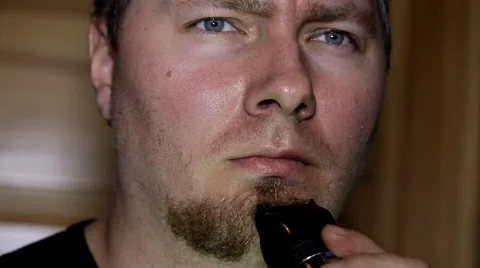 Man shaving his beard Stock Footage 36645730