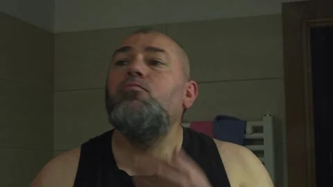 Man Shaving His Beard at Home Using a Modern Electric Clipper Stock Footage 337164579