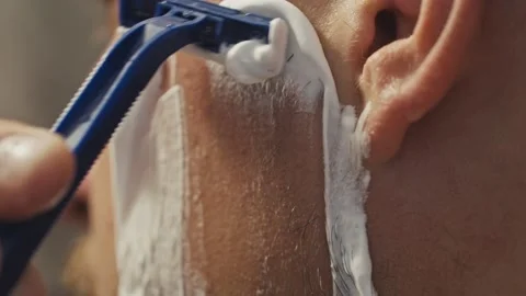 Man shaving his face in 4k UHD Stock Footage 147206853
