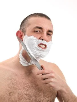 Man shaving with a knife Stock Photos