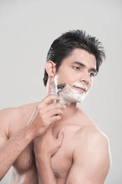 Man shaving Stock Photos