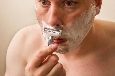 Man shaving Stock Photos