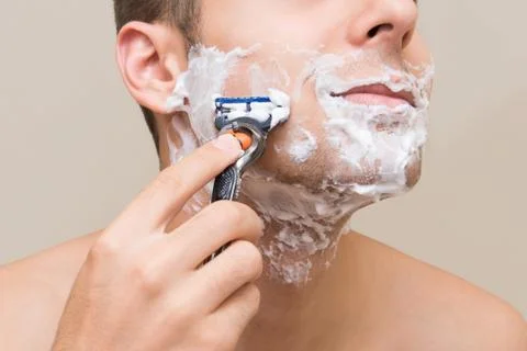 The man is shaving Stock Photos