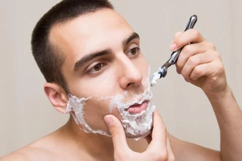 The man is shaving Foto stock