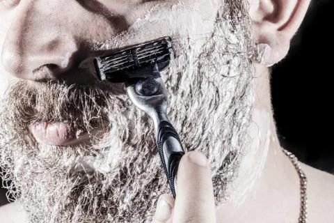 The man is shaving Stock Photos