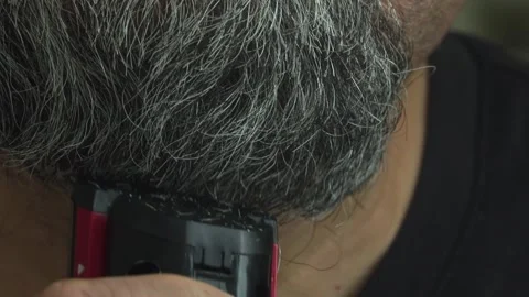 Man Shaving Stubble from Face Using Electronic Hair Trimmer Stock Footage 337164604