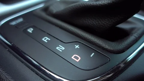 Man shifting gear, Close up of hand on automatic modern gear. Stock Footage 107858843