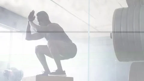 Man shifting swinging exploding onto plyo box landing stabilizing for fitness Stock Footage 334203791