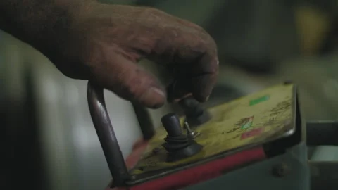 Man shifts lever on a machine Stock Footage 275073551