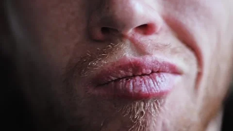 Man Shifts Puckered Lips Side To Side In Slow Motion Close Up Portrait Stock Footage 325276499