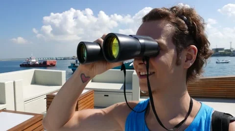 The man on the ship looking through binoculars 動画素材 64627871