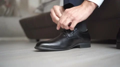 A man shoes black shoes with lacing. men's fashion. business style. Stock Footage