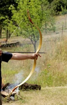 Man shooting with bow Stock Photos