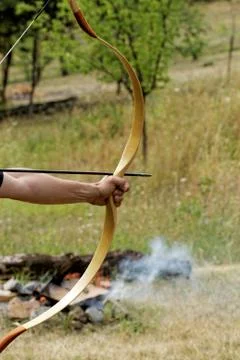 Man shooting with bow Stock Photos