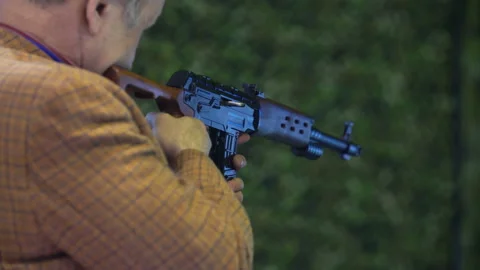 Man in shooting gallery Stock Footage 88680091