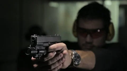 Man shooting a gun Stock Footage 61571527