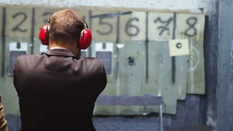 Man shooting with gun at target Stock-Footage 144313254