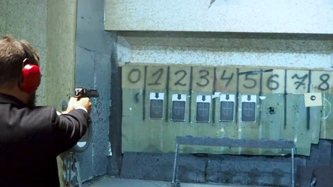 Man shooting with gun at target Stock-Footage 144313846
