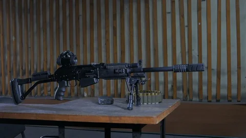 A man in a shooting range loading the 12th caliber carbine. Stock Footage 113356186