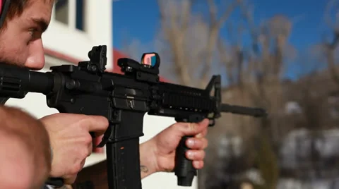 Man shooting semi-automatic AR-15 Rifle Stock Footage 33722580