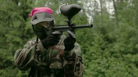 A man shooting seven times using the paintball  fs700 odyssey 7q Stock Footage 40080710