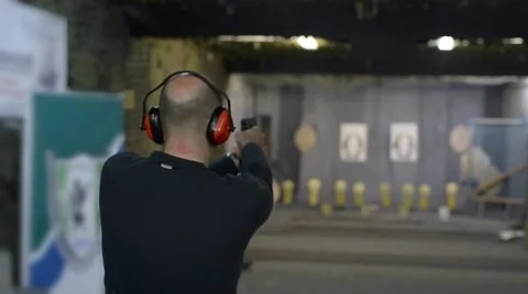 A man shooting at a shooting range Stock Footage 62634382