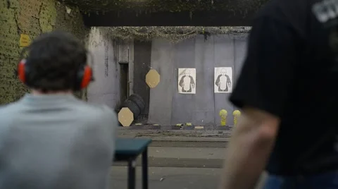 A man shooting at a shooting range Видео 62634490