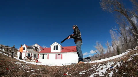Man shooting skeet with shotgun Stock Footage 33722575