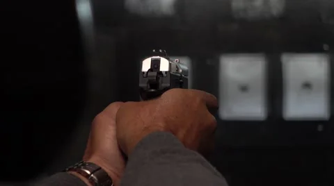 Man shooting targets in a range Stock Footage 61584052