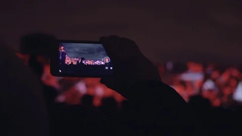 Man shoots 3D mapping light show on a mobile phone. Stock Footage 82241269