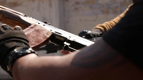Man shoots from AK Stock Footage 119517617